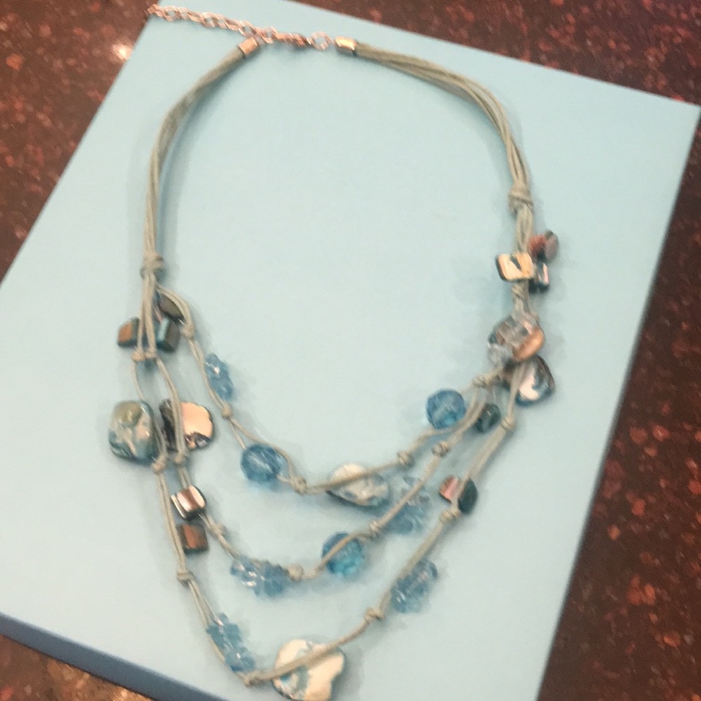 Adjustable rope and stone necklace.